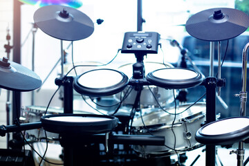 Selective focus to electronic cymbals of electronic drum set in music room. The concept of...