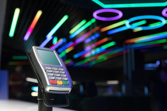 Pos reader sale in front of abstract background in light - equipment for credit card