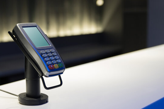 Pos reader sale on the table in public building - equipment for credit card