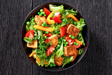 tofu salad with greens and vegetables in bowl - Powered by Adobe