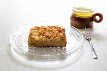 traditional German Streuselkuchen (crumb cake) on glass plate