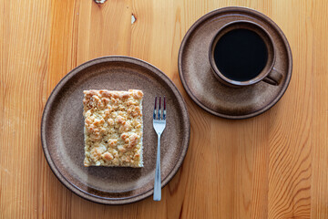 traditional German Streuselkuchen (crumb cake) on earthenware plate