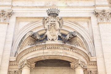Fototapeta na wymiar Sant'Andrea al Quirinale Basilica Facade Sculpted Detail Above the Entrance in Rome, Italy