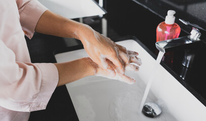 Wash hands with soap and clean water. Protection bacteria by washing hands frequently. Health care concept
