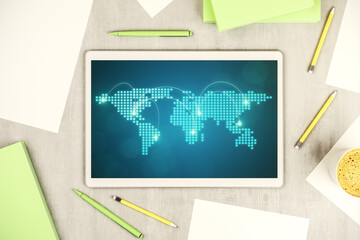 Abstract creative world map with connections on modern digital tablet screen, international trading concept. Top view. 3D Rendering