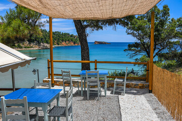 Beautiful restaurant view towards Chrisi Milia beach in Alonissos island, Greece