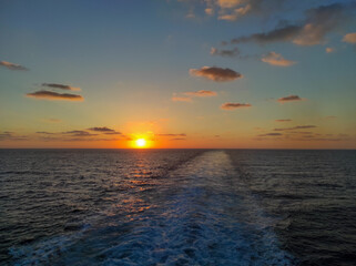 sunset over the sea from a boat