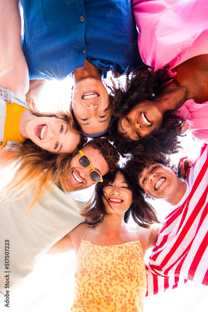 Wall mural Group of young best friends bonding outdoors - Multiracial people bonding and having fun at the beach during summer vacation