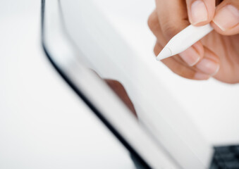 Close up white electronic pen or pencil in hand, write, draw or sign on digital tablet screen, computer isolated on white background. Business and technology concept. Working with tech device.