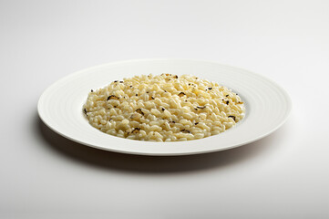 Black truffle risotto in white plate