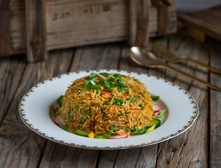 chinese fried rice served in a dish isolated on wooden background side view of rice