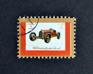 Ajman - circa 1973 : Cancelled postage stamp printed by Ajman, that shows Antique vehicle, circa...
