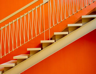 Metal stairs on the big orange wall