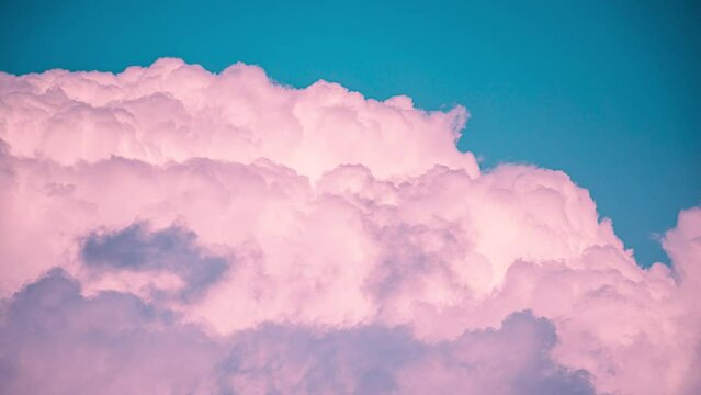 Toned vortical clouds. Pink Clouds Cloud Sky Moving In Blue Sky. Background Cloudscape Time Lapse, Timelapse, Time-lapse. Background. Abstract Pink color. big heavy raging turbulent cloudscape