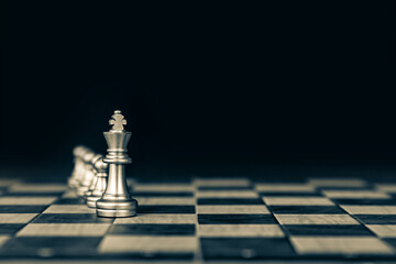 King chess stand front the line on chessboard concept of challenge or team player or business team and leadership strategy or strategic planning and human resources organization risk management.