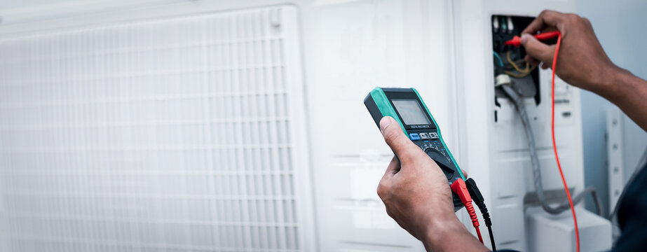 Air conditioner technicians use a multimeter to check electricity and Part of the preparation to install a new air conditioner.