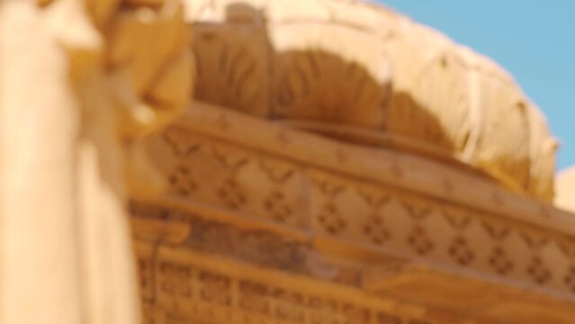 Rack focus shot of top portion of the dome of the cenotaph at Bada bagh in Jaisalmer, Rajasthan, India. Focus changes from the pillar to the carvings of the dome. Ancient architecture background. 
