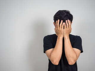 Depressed man hold his face feels hopeless copy space