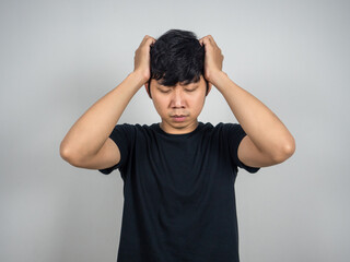 Fototapeta na wymiar Asian man sadness hold his head portrait