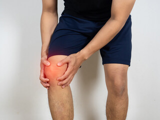 Man hurt his knee hold by hand white background