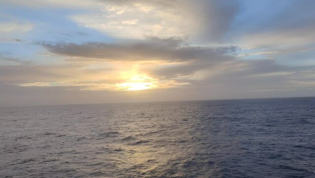 Sunrise view from a boat on the high seas enjoying the calm of the sea