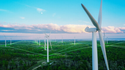 Scenic Aerial Drone Footage of Environmental Wind Turbines in a Forest Near the Sea. Green Renewable Energy Park with VFX Augmented Reality Holograms Shows Internet of Things Online Connectivity.
