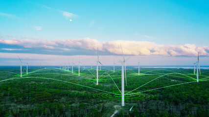 Scenic Aerial Drone Footage of Environmental Wind Turbines in a Forest Near the Sea. Green...