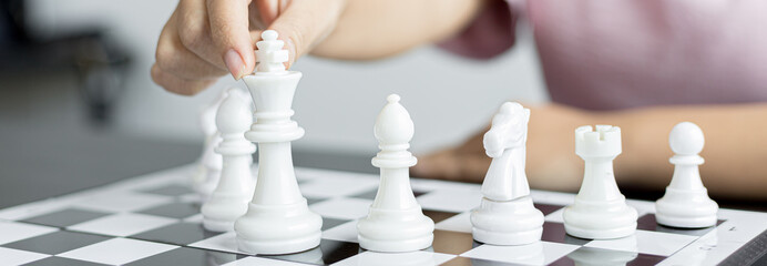 Businesswoman playing chess, Proactive business planning and marketing strategy just like playing...