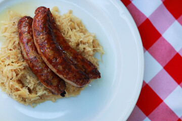 Tasty  bratwurst sausages  and cabbage on plate