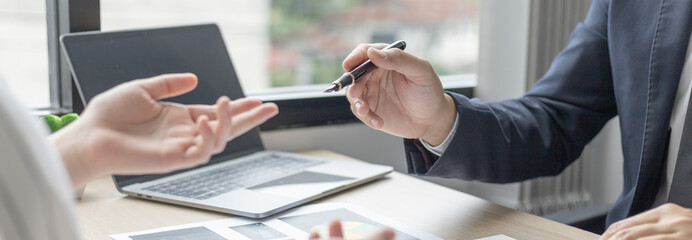 Brainstorm team, Marketers and financial accountants are discussing and analyzing charts to plan strategies to meet customer needs, Team meetings or business consulting.