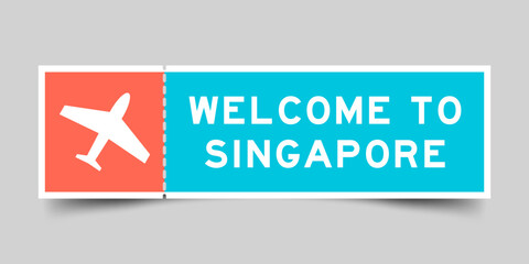 Orange and blue color ticket with plane icon and word welcome to singapore on gray background