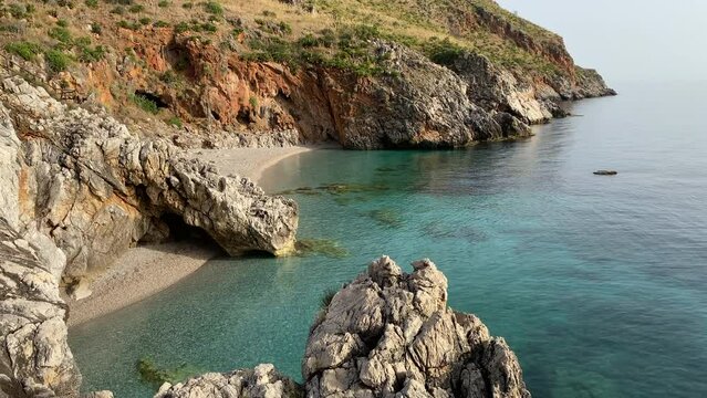 Paradise beach and turquoise sea at "Cala Capreria" into natural reserve &ldquo;Riserva dello Zingaro&rdquo;, Scopello, Sicily, Mediterranean Sea, Italy.