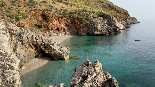Paradise beach and turquoise sea at "Cala Capreria" into natural reserve &ldquo;Riserva dello Zingaro&rdquo;, Scopello, Sicily, Mediterranean Sea, Italy.