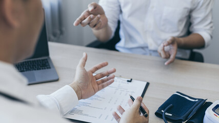 Male doctor made a diagnosis on a male patient and gave advice on treatment methods in the hospital examination room, Helping patients with medical advice, Health care counseling.