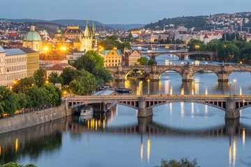 Fototapeta na wymiar Prague cityscape at night. Prague old town, Charles bridge and Vltava river, Czech Republic.