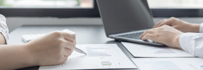 Business brainstorming, Marketers and accountants are analyzing business data using laptops at work, Using business data graphs in meetings, Business team discussions..