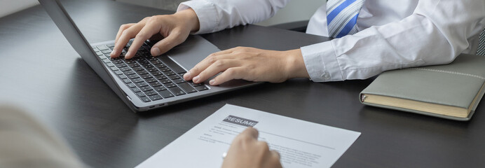 Job application, Employer or HR examines the applicant's information with a laptop to check their work history and ability to perform, Manager resource employment and recruitment.