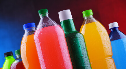 Plastic bottles of assorted carbonated soft drinks