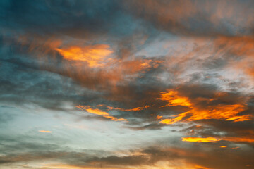 beautiful landscape on sea with sunset, dramatic clouds with red fire