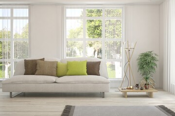 White living room with sofa and summer landscape in window. Scandinavian interior design. 3D illustration