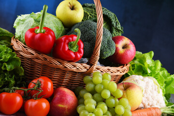 Fresh organic fruits and vegetables in wicker basket