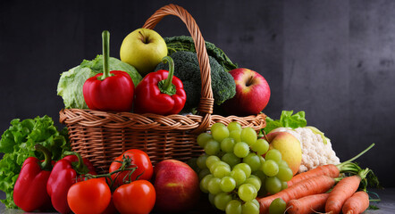 Fresh organic fruits and vegetables in wicker basket