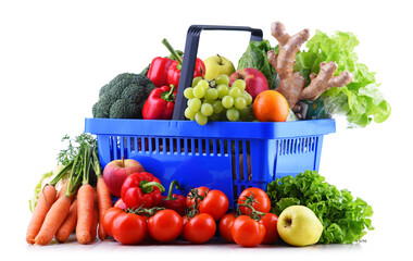 Fresh organic fruits and vegetables in plastic shopping basket