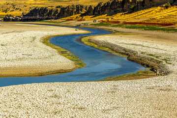 Arid and low-water rivers, dry and cracked soils on their banks
