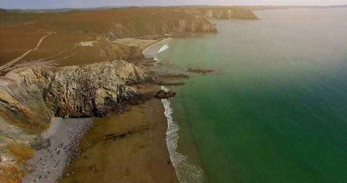 Aerial view of cliffs of Etretat at sunset. Etretat Normandy Shore Sea. France, Normandy, Aerial view of Etretat Aval cliff, rocks and natural arch landmark.