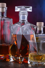 Carafe and bottles of assorted alcoholic beverages