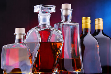 Carafe and bottles of assorted alcoholic beverages