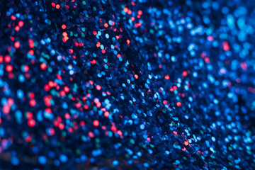 Neon bokeh glow. Defocused sequin texture. Cyber illumination. Blur fluorescent navy blue red color...