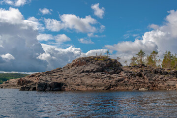 Fototapeta na wymiar Nature of Karelia. View of the sea and rocks. Summer trip to the north.