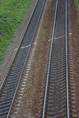 Fototapeta na wymiar railway tracks,two railway tracks on which trains travel the old electrical, top view